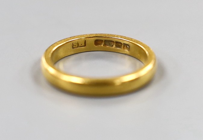 A 22ct gold wedding band, size J, 4.3 grams.